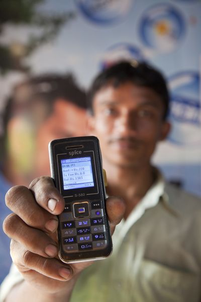 GCE IO, closeup of cell phone man holding at arms length